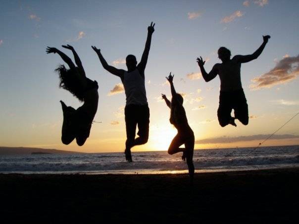 People happy jumping on the beach