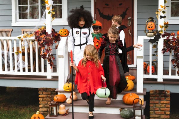 kids wearing Halloween costumes