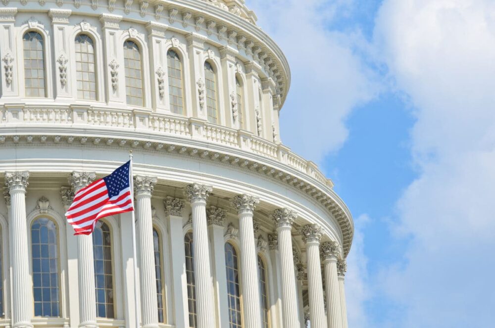 Government Scrutiny on Opioids state capitol building and American flag